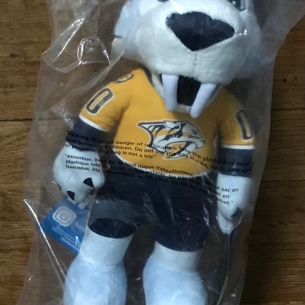 A NFL plush mascot toy name Gnash its a sabretooth  tiger
